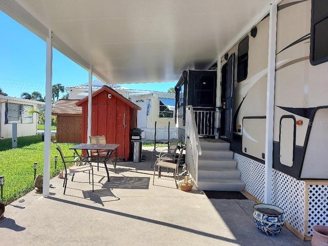 view of patio / terrace with a storage unit