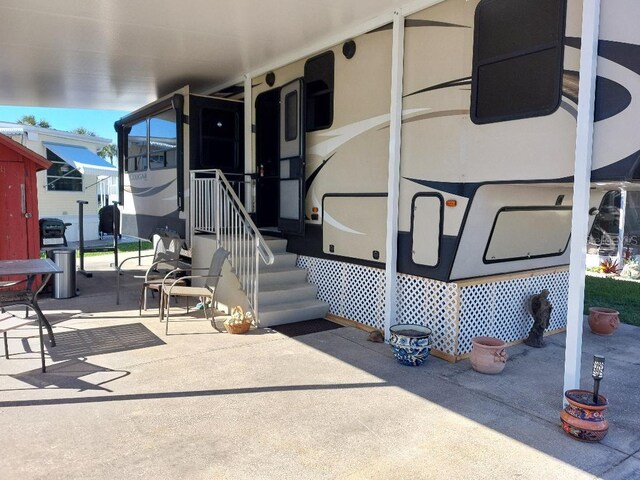 6688 SE 55th Ln Unit 6688, Okeechobee, FL 34974 - property entrance with a patio area