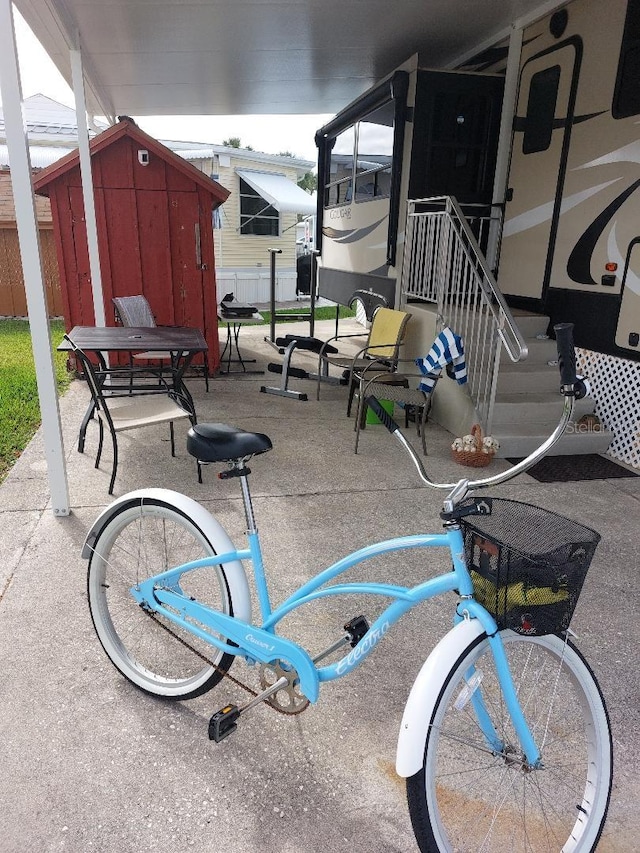 6688 SE 55th Ln Unit 6688, Okeechobee, FL 34974 - view of patio with a storage unit