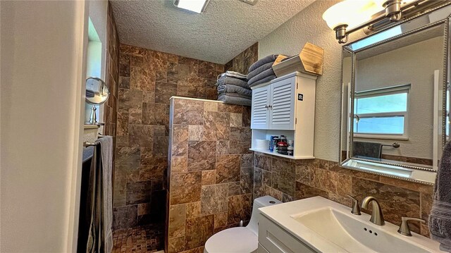 bathroom featuring a textured ceiling, toilet, a shower with curtain, tasteful backsplash, and vanity