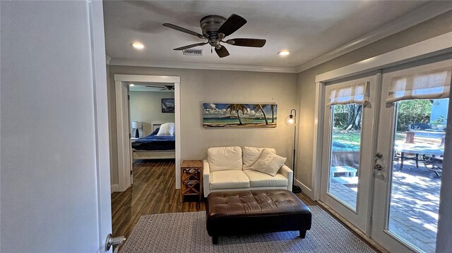 sitting room with french doors, ceiling fan, and dark hardwood / wood-style floors