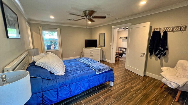 bedroom featuring crown molding, dark wood-type flooring, and ceiling fan