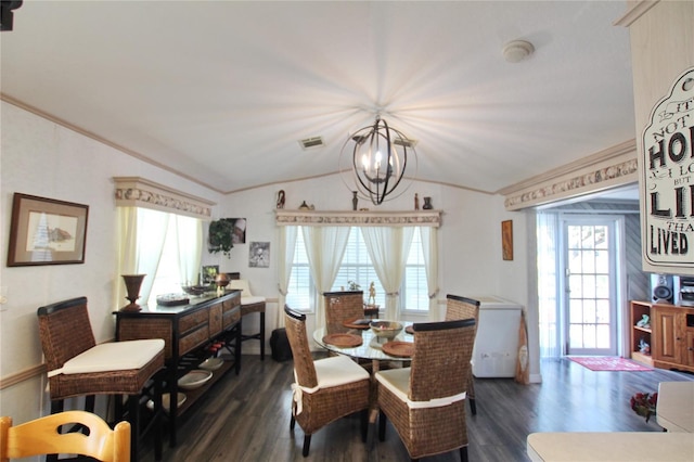 dining room with lofted ceiling, a wealth of natural light, ornamental molding, and dark wood-type flooring