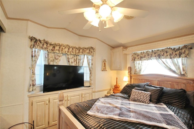 bedroom with lofted ceiling, a ceiling fan, and crown molding