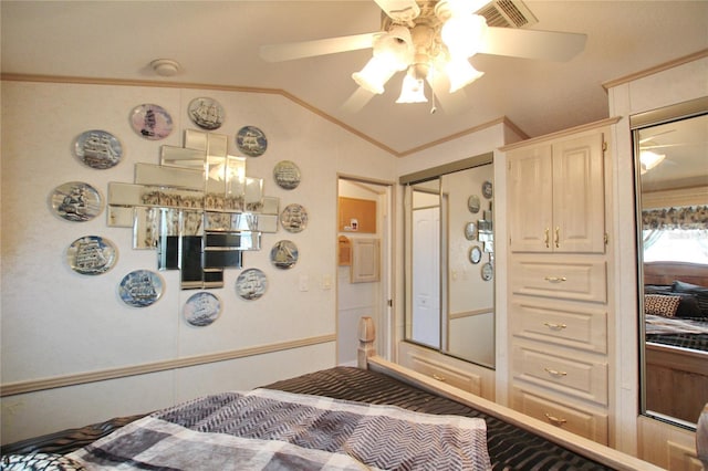 bedroom with lofted ceiling, a ceiling fan, visible vents, and crown molding