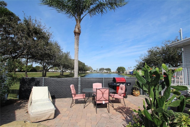 view of patio / terrace with outdoor dining space and fence