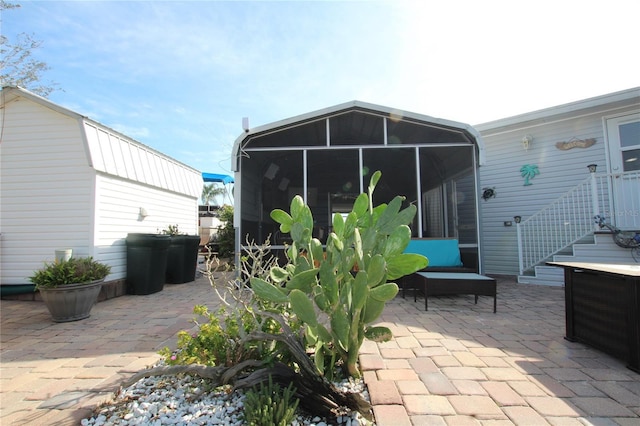 view of patio with a sunroom