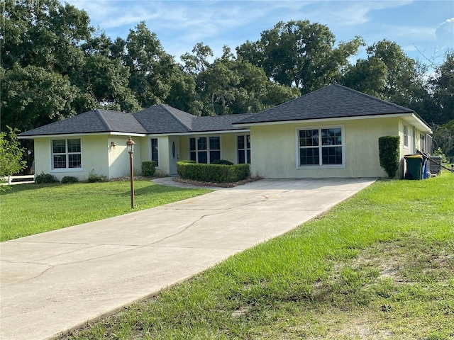 ranch-style home with a front yard