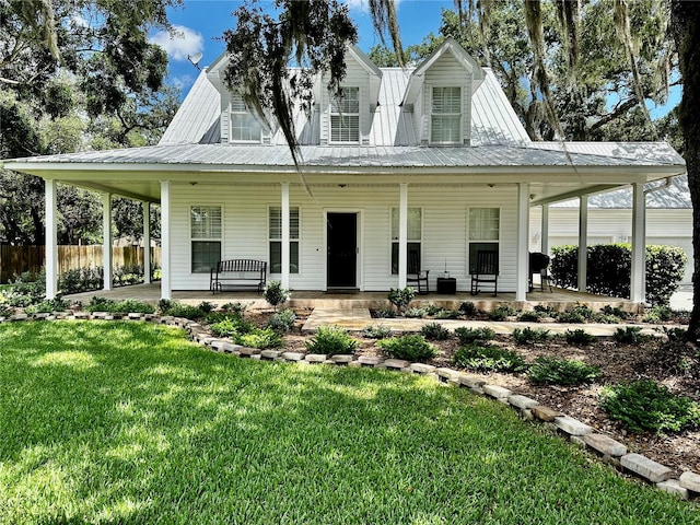 view of front facade with covered porch and a front lawn