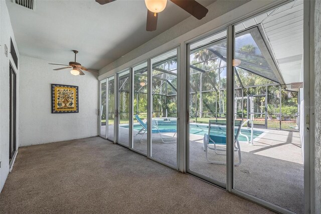 unfurnished sunroom with visible vents and a healthy amount of sunlight