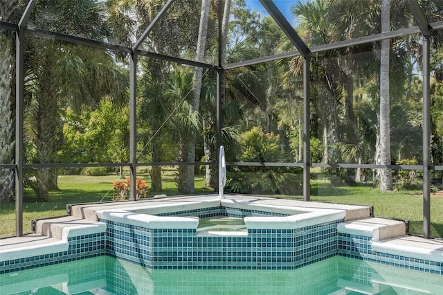 view of swimming pool with glass enclosure and an in ground hot tub