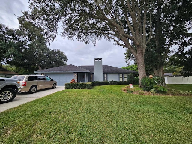 single story home with a garage and a front yard