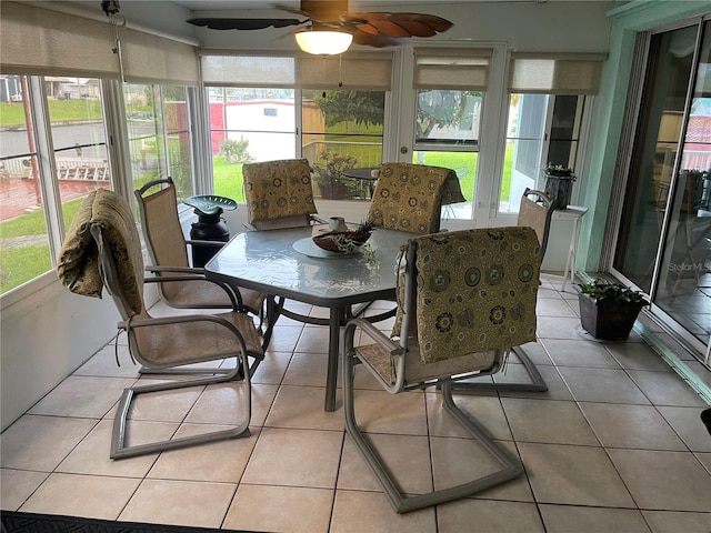 sunroom featuring ceiling fan