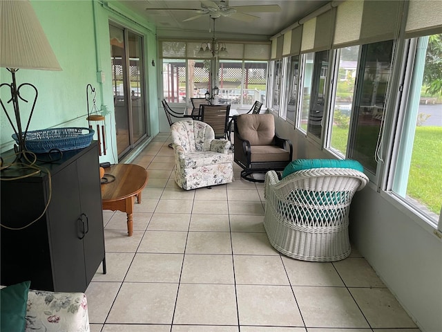 sunroom / solarium featuring ceiling fan and plenty of natural light