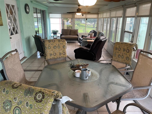 sunroom / solarium featuring ceiling fan