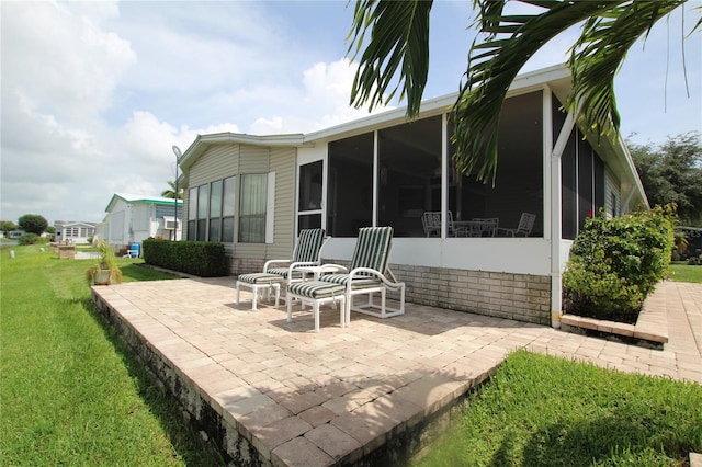 view of patio featuring a sunroom