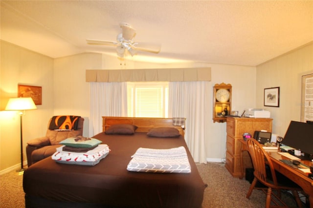 carpeted bedroom featuring lofted ceiling, ceiling fan, and a textured ceiling