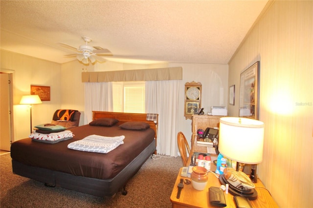 bedroom with a textured ceiling, carpet flooring, and ceiling fan