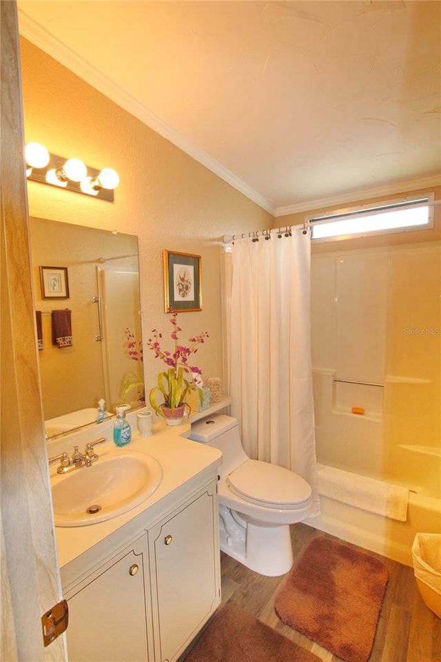 full bathroom with hardwood / wood-style floors, toilet, ornamental molding, and vanity