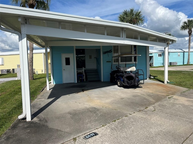 view of car parking featuring a yard and a carport