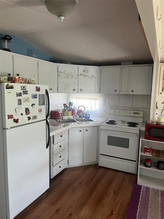 6697 SE 51st Ln Iii, Unit Iii, Okeechobee, FL 34974 - kitchen featuring white cabinetry, light countertops, white appliances, a sink, and dark wood-style floors