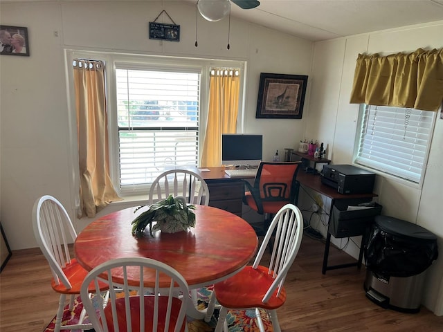 dining area featuring lofted ceiling, ceiling fan, and hardwood / wood-style floors