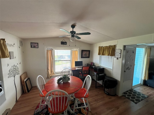 dining area with lofted ceiling, hardwood / wood-style flooring, and ceiling fan