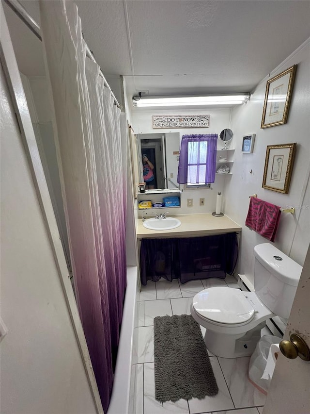 6697 SE 51st Ln Iii, Unit Iii, Okeechobee, FL 34974 - bathroom featuring marble finish floor, vanity, and toilet