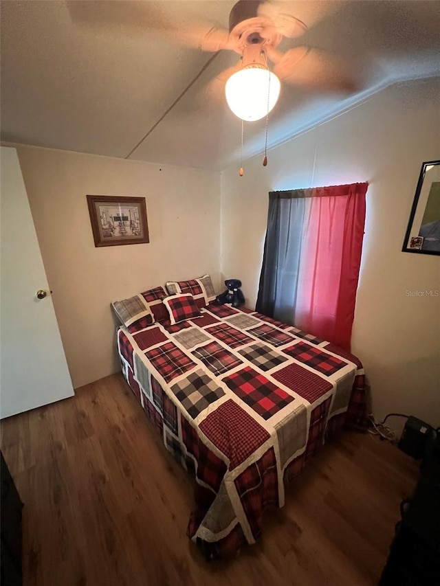 bedroom featuring ceiling fan and hardwood / wood-style flooring