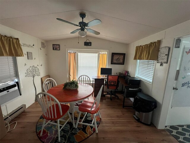 dining room with vaulted ceiling, dark hardwood / wood-style flooring, baseboard heating, and ceiling fan