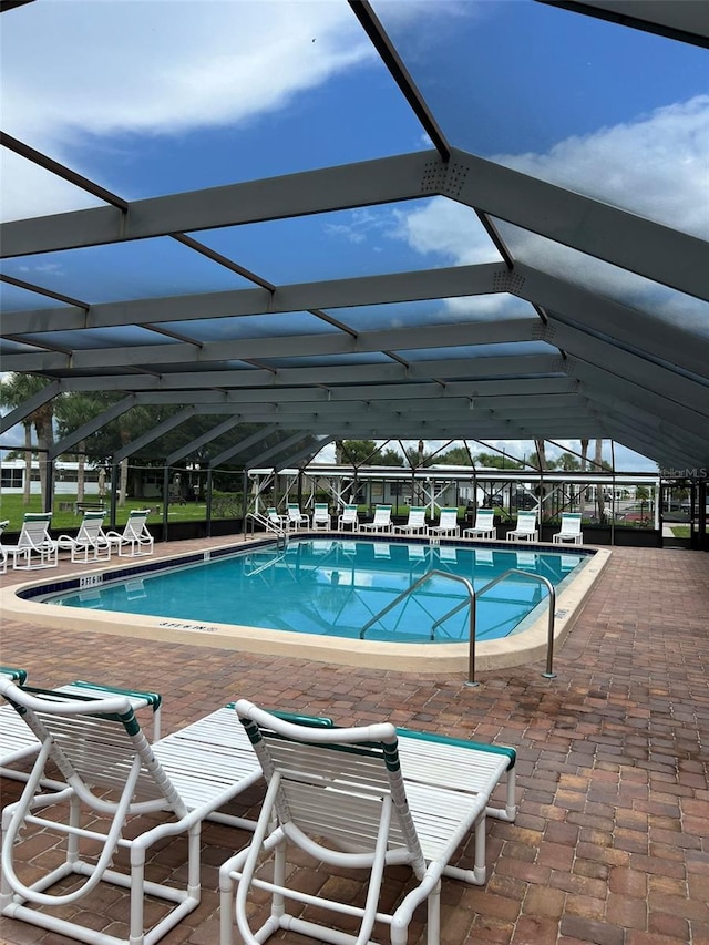 view of pool featuring a lanai and a patio area