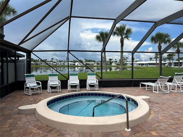 6697 SE 51st Ln Iii, Unit Iii, Okeechobee, FL 34974 - view of swimming pool with a patio, a water view, a lanai, and a community hot tub