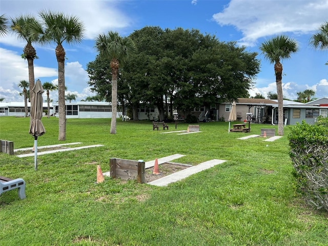 6697 SE 51st Ln Iii, Unit Iii, Okeechobee, FL 34974 - view of home's community featuring a yard