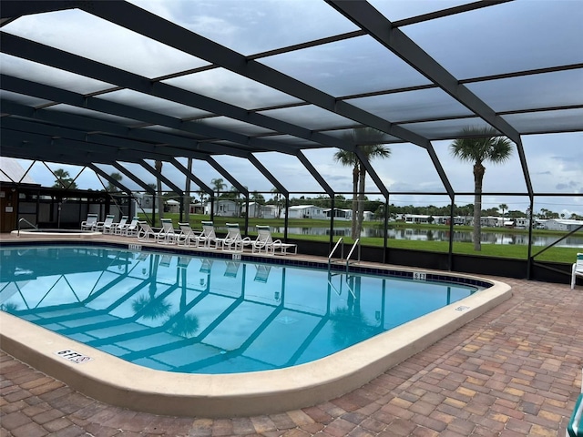 6697 SE 51st Ln Iii, Unit Iii, Okeechobee, FL 34974 - community pool featuring a patio, a water view, and a lanai