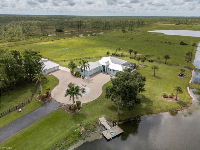 birds eye view of property with a water view and a rural view