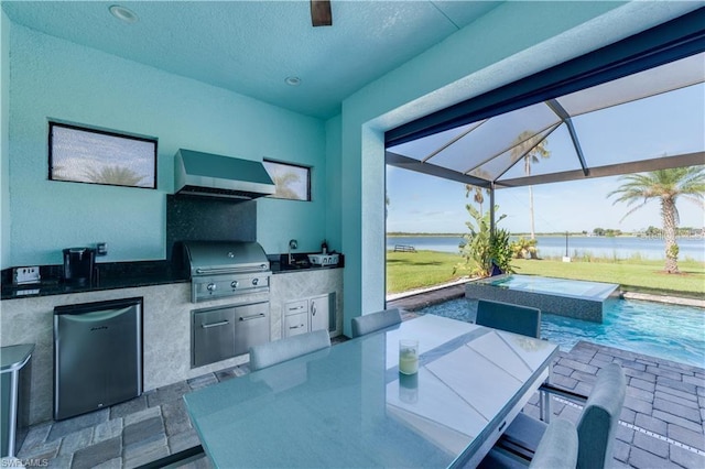 view of patio with glass enclosure, a water view, and area for grilling