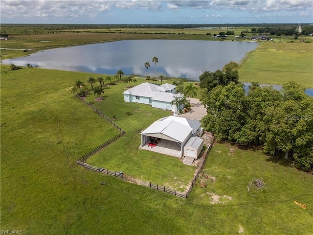 birds eye view of property featuring a water view and a rural view