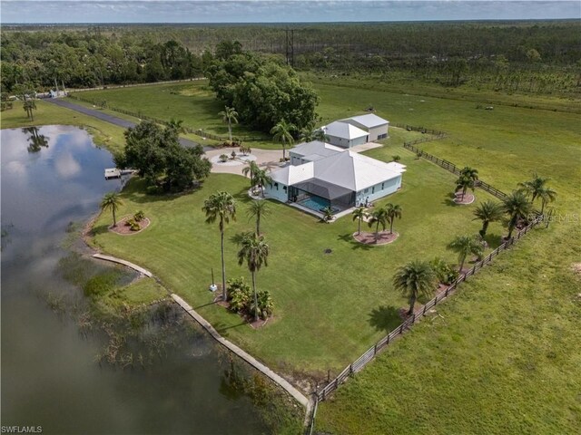 drone / aerial view featuring a water view and a rural view