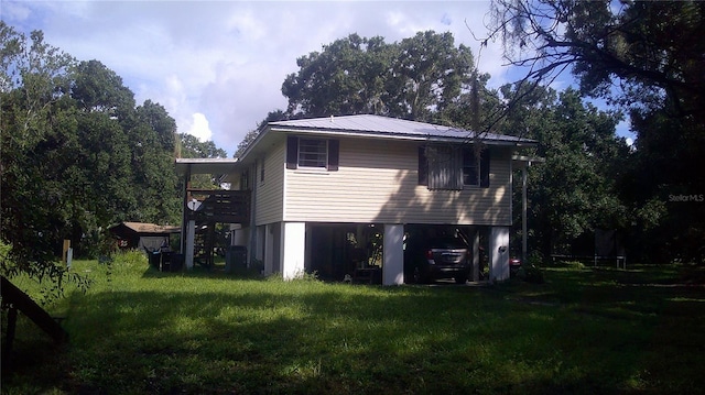 view of property exterior with a lawn