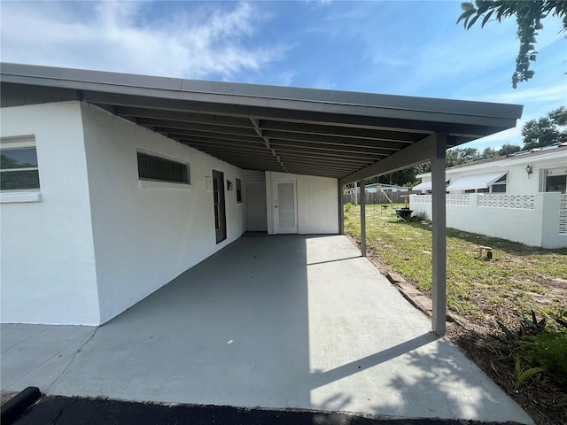 view of parking / parking lot with a carport