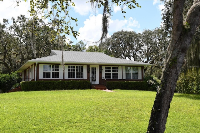 ranch-style house with a front lawn