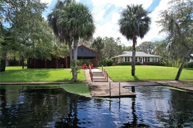 surrounding community featuring a water view, a gazebo, and a yard