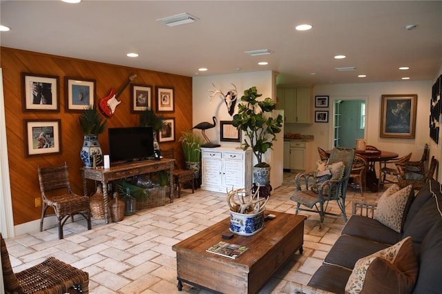 living room with wood walls