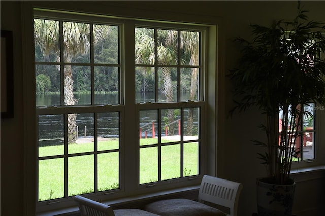 doorway to outside with a water view