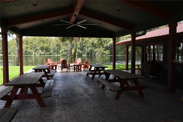 view of patio / terrace with ceiling fan and a water view