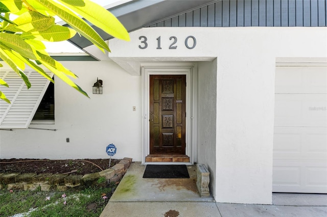 property entrance with a garage