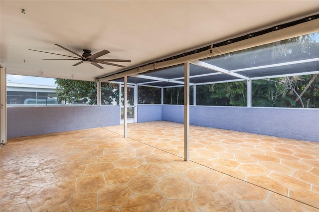 view of patio featuring ceiling fan and a lanai