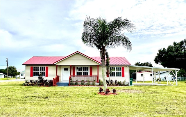 ranch-style house featuring a carport, a porch, and a front lawn