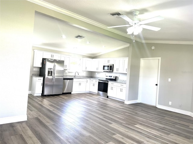 kitchen featuring white cabinets, ceiling fan, appliances with stainless steel finishes, and crown molding