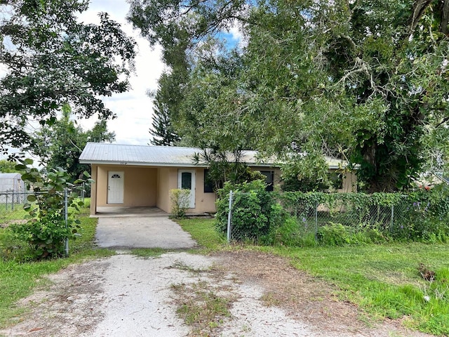 view of front facade with a carport